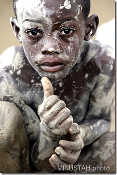 haitian child in Cabaret covered with mud from the devastating floods caused by hurricane Hanna and Gustav